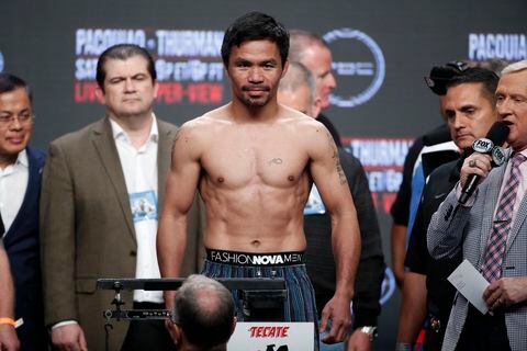 Manny Pacquiao stands on the scale during a weigh-in Las Vegas.