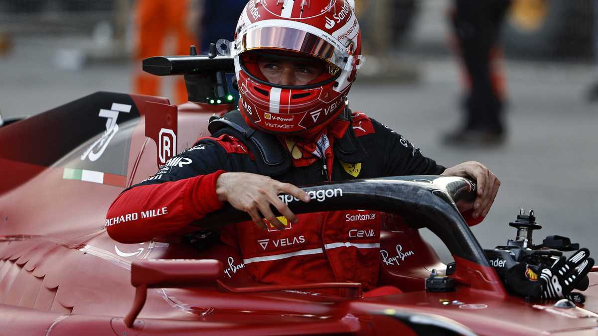 Ferrari's Monegasque driver Charles Leclerc celebrates after claiming pole position in the qualifying session for the Formula One Azerbaijan Grand Prix at the Baku City Circuit in Baku on June 11, 2022. (Photo by HAMAD I MOHAMMED / POOL / AFP)