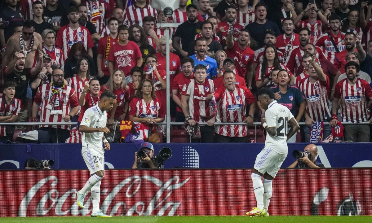 FILE - Real Madrid's Rodrygo, left, celebrates after scoring with his teammate Real Madrid's Vinicius Junior the opening goal during the Spanish La Liga soccer match between Atletico Madrid and Real Madrid at the Wanda Metropolitano stadium in Madrid, Spain, Sept. 18, 2022. With a goal and a dance, Real Madrid's young Brazilian forwards made a strong statement against racism in soccer this weekend. With their samba-like moves after a goal in the derby against Atletico on Sunday, Rodrygo and Vinícius Junior made it clear they are not backing down. (AP/Manu Fernandez)
