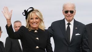 U.S. President Joe Biden and first lady Jill Biden board Air Force One to return to Washington after attending the funeral of Queen Elizabeth, from Stansted Airport, Britain, September 19, 2022. REUTERS/Kevin Lamarque