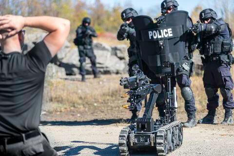 Police Swat Team Officers Using a Mechanical Robot Unit