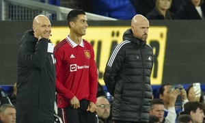 Manchester United's Cristiano Ronaldo stands next to Manchester United's head coach Erik ten Hag, right, waiting to replace teammate Anthony Martial during the Premier League soccer match between Everton and Manchester United at Goodison Park, in Liverpool, England, Sunday Oct. 9, 2022. (AP Photo/Jon Super)