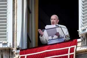 Pope Francis speaks from a window of the apostolic palace overlooking St. Peter's Square in the Vatican during the weekly Angelus prayer followed by the recitation of the Regina Coeli on May 09, 2021. (Photo by Vincenzo PINTO / AFP)