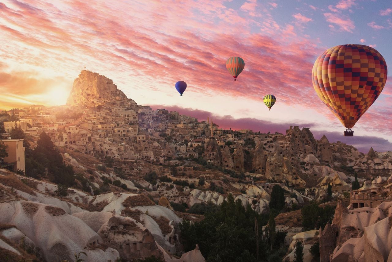 Hot air balloons flying over cappadocia.