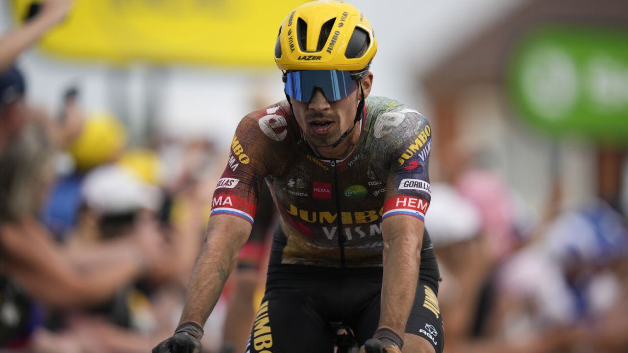 Slovenia's Primoz Roglic crosses the finish line with a delay on his main rival Slovenia's Tadej Pogacar during the fifth stage of the Tour de France cycling race over 157 kilometers (97.6 miles) with start in Lille Metropole and finish in Arenberg Porte du Hainaut, France, Wednesday, July 6, 2022. (AP Photo/Daniel Cole)