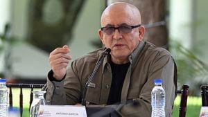 The first commander of the Colombian National Liberation Army (ELN), Antonio Garcia, speaks to the press during the document signing ceremony with the Colombian Government after announcing new peace talks, in Caracas, on October 4, 2022. - Colombia's government and a delegation from the National Liberation Army (ELN) leftist guerrillas announced on Tuesday they would next month restart peace talks suspended since 2019. ELN commander Antonio Garcia read out a statement in Caracas stating that the two parties would re-establish "the dialogue process after the first week of November 2022" with Venezuela, Cuba and Norway acting as guarantors for the talks. (Photo by Yuri CORTEZ / AFP)