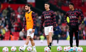 Manchester United's Bruno Fernandes, Cristiano Ronaldo and Marcus Rashford warm up on the pitch ahead of the Premier League match at Old Trafford, Manchester. Picture date: Thursday April 28, 2022. (Photo by Martin Rickett/PA Images via Getty Images)