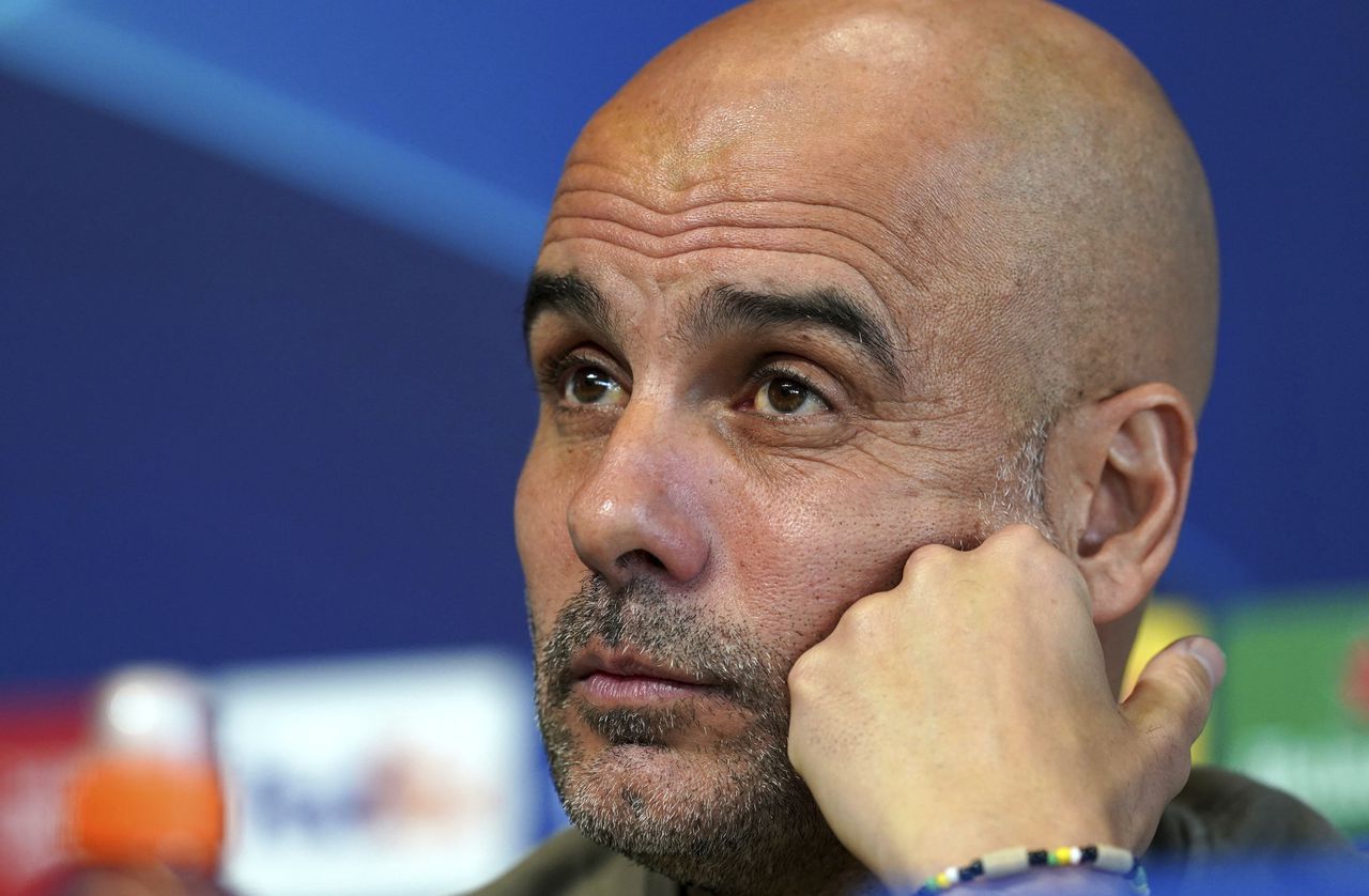 Manchester City manager Pep Guardiola meets the media during a press conference ahead of Wednesday's Champions League, semifinal, return-leg soccer match against Real Madrid, at City Football Academy, Manchester, England, Tuesday May 16, 2023. (Martin Rickett/PA via AP)