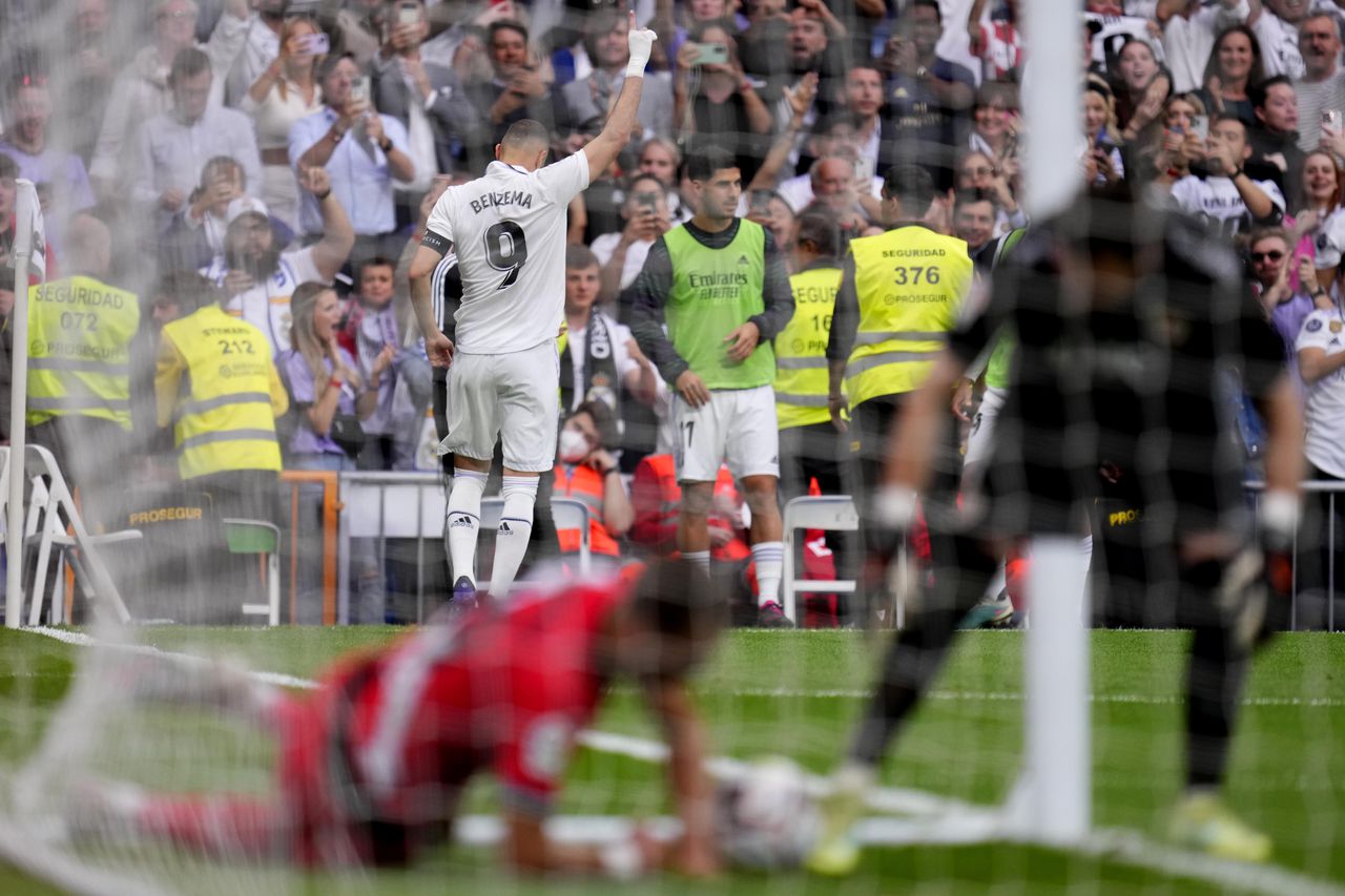 Real Madrid's Karim Benzema celebrates after scoring his side's opening goal during a Spanish La Liga soccer match between Real Madrid and Rayo Vallecano at the Santiago Bernabeu stadium in Madrid, Spain, Wednesday, May 24, 2023. (AP Photo/Manu Fernandez)