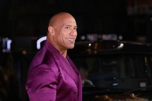 Dwayne Johnson poses for photographers upon arrival for the premiere of the film 'Black Adam' on Tuesday, Oct. 18, 2022, in London. (Photo by Vianney Le Caer/Invision/AP)