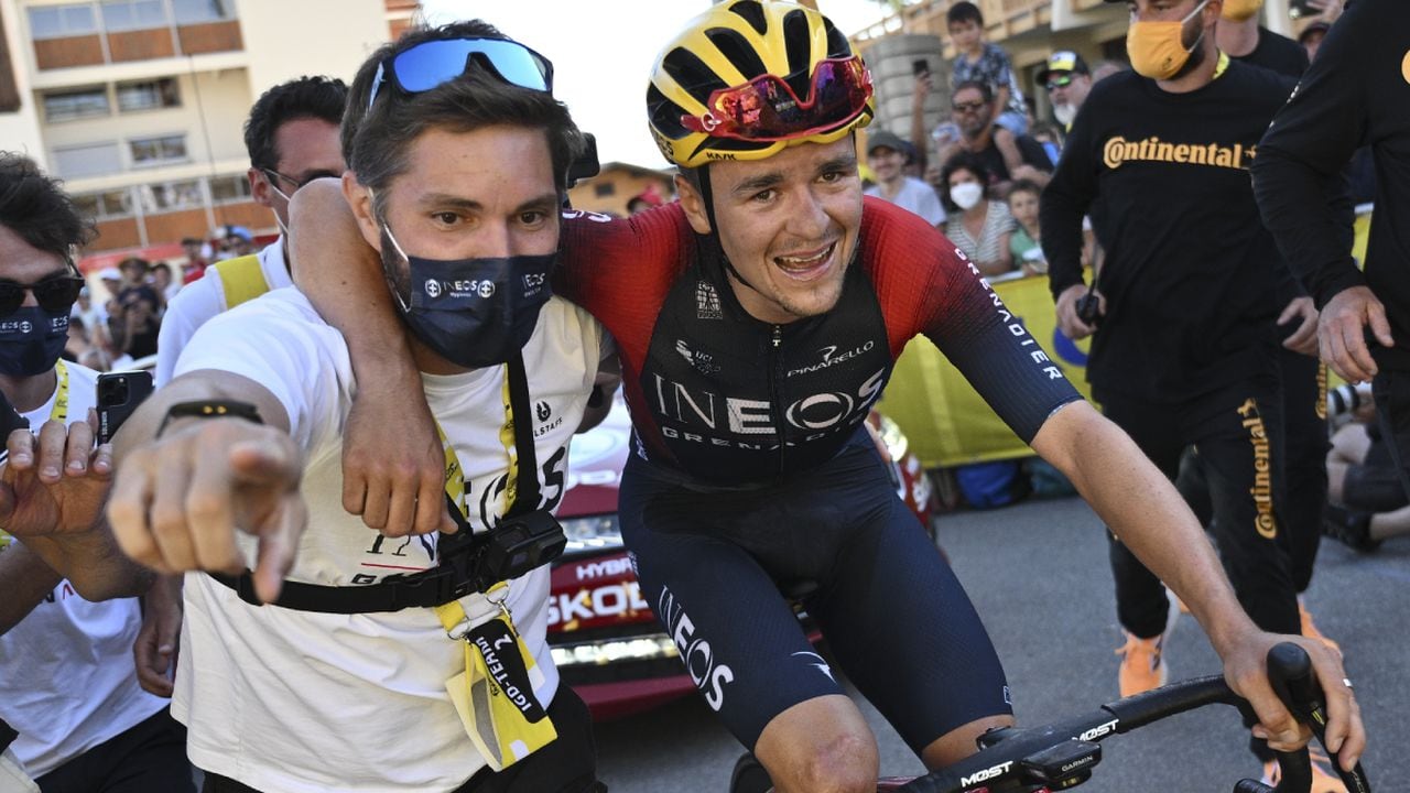 Stage winner Britain's Thomas Pidcock is taken to the podium after the twelfth stage of the Tour de France cycling race over 165.5 kilometers (102.8 miles) with start in Briancon and finish in Alpe d'Huez, France, Thursday, July 14, 2022. (AP/Marco Bertorello/Pool)
