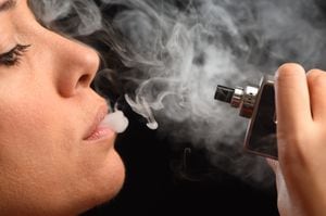 Close up shot of using an electronic cigarette. Vaping concept.