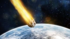 Digital illustration of asteroid entering atmosphere of a blue planet.