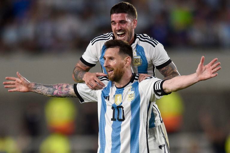 Argentina's Lionel Messi celebrates with teammate Rodrigo De Paul after scoring his side's second goal against Panama during an international friendly soccer match in Buenos Aires, Argentina, Thursday, March 23, 2023. (AP Photo/Gustavo Garello)