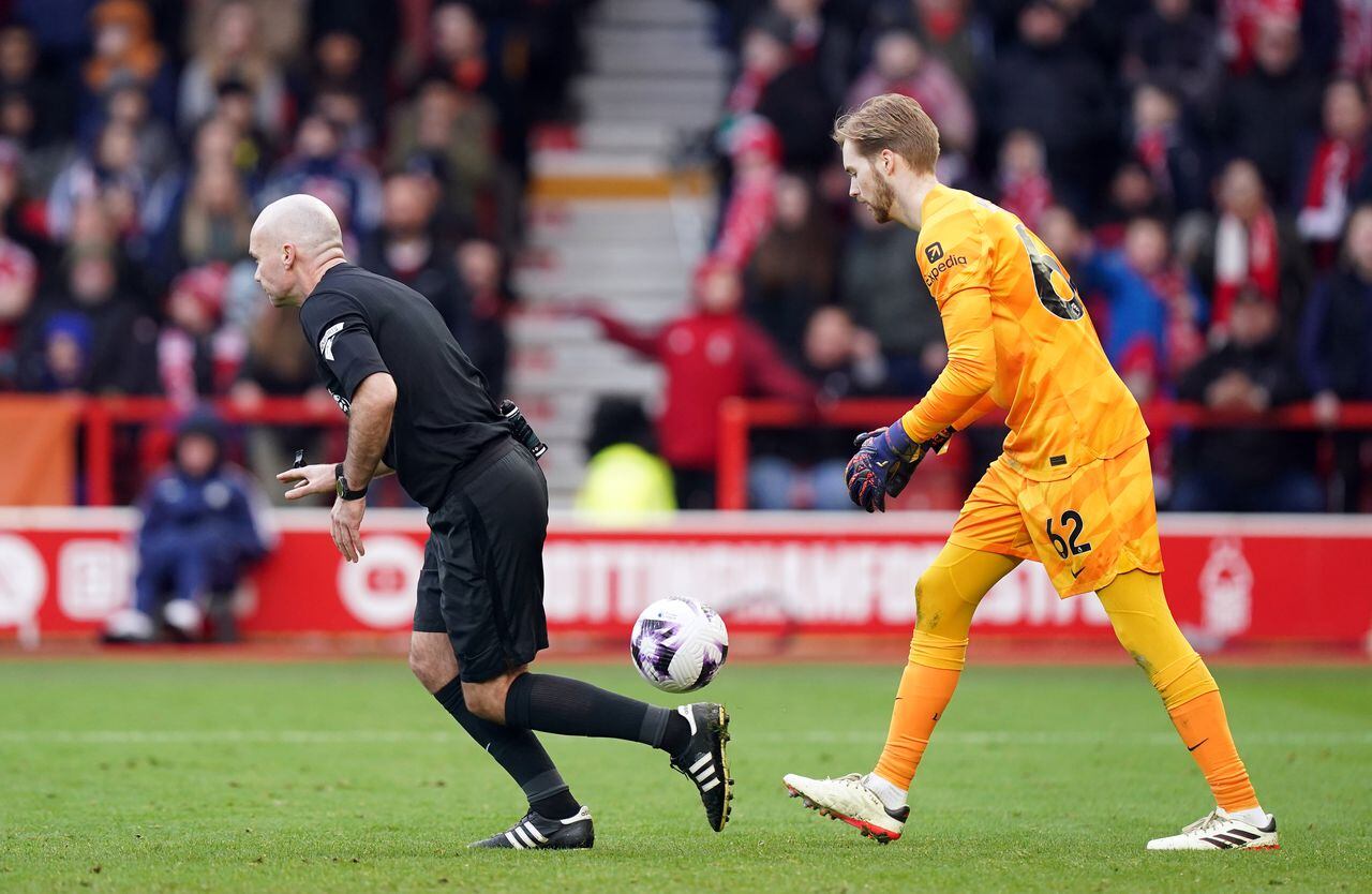 Referee Paul Tierney signals an unopposed drop ball to Liverpool, as Caoimhin Kelleher claims the ball during the Premier League match at The City Ground, Nottingham. Picture date: Saturday March 2, 2024. (Photo by Mike Egerton/PA Images via Getty Images)