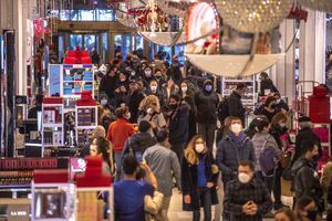 People shop in Macy's on Nov. 26, 2021, in New York. (AP Photo/Brittainy Newman, File)