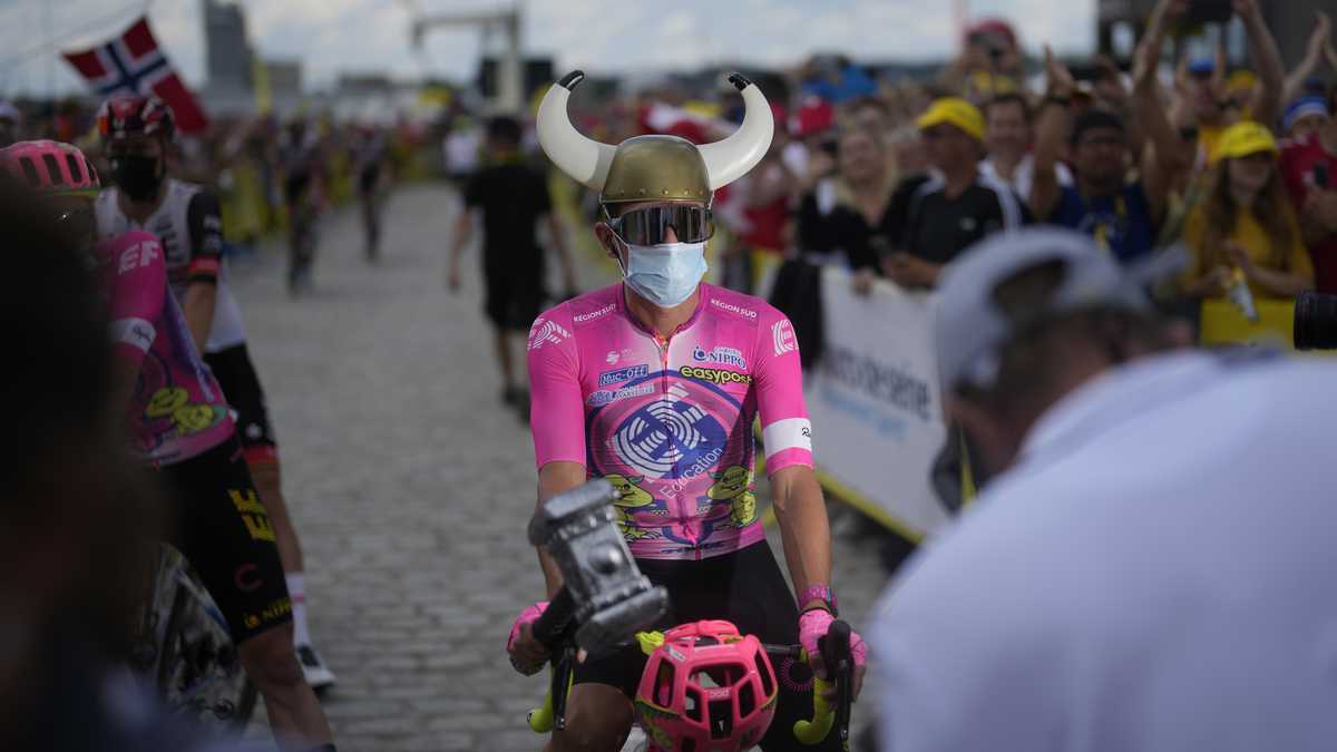 Colombia's Rigoberto Uran poses with a Viking helmet and a hammer prior to the third stage of the Tour de France cycling race over 182 kilometers (113 miles) with start in Vejle and finish in Sonderborg, Denmark, Sunday, July 3, 2022. (AP Photo/Thibault Camus)