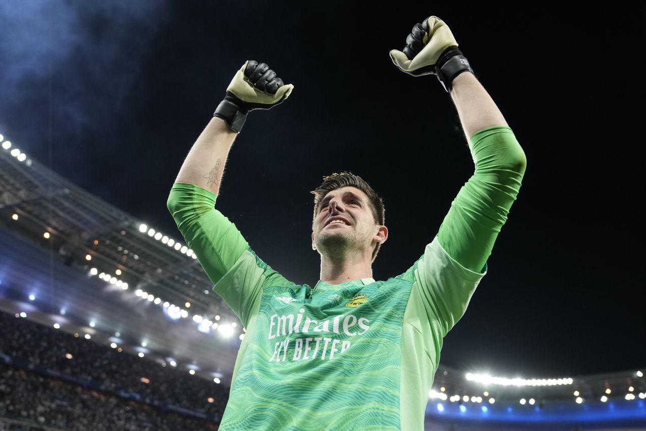 Real Madrid's goalkeeper Thibaut Courtois celebrates after winning the Champions League final soccer match between Liverpool and Real Madrid at the Stade de France in Saint Denis near Paris, Saturday, May 28, 2022. (AP Photo/Frank Augstein)
