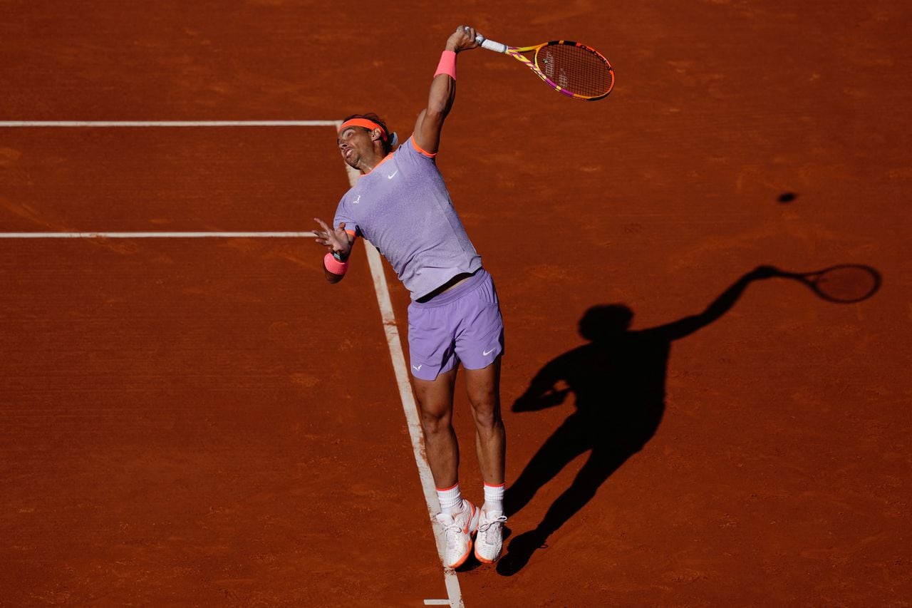 Spain's Rafael Nadal serves the ball to Italy's Flavio Cobolli during the ATP Barcelona Open "Conde de Godo" tennis tournament singles match at the Real Club de Tenis in Barcelona, on April 16, 2024. (Photo by Pau Barrena / AFP)