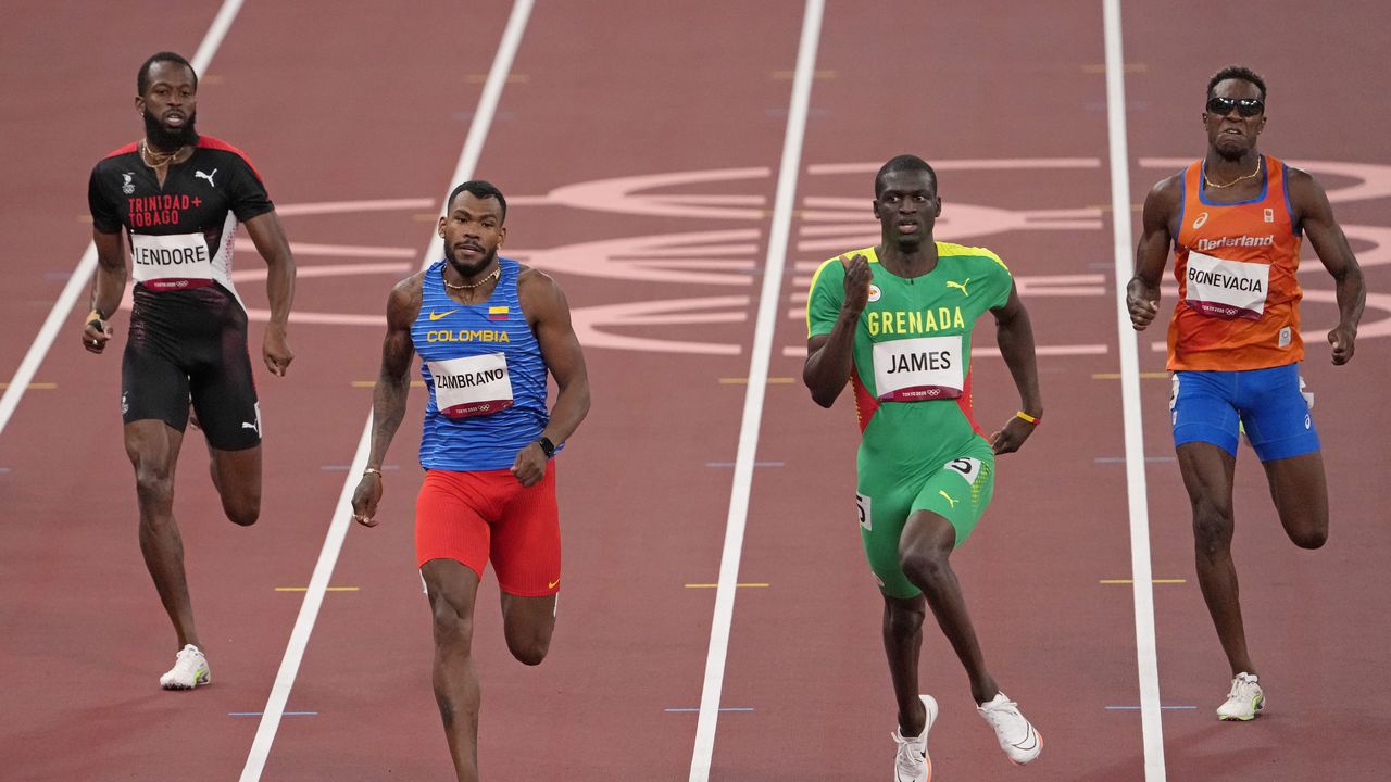 Deon Lendore, of Trinidad and Tobago, Anthony Zambrano, of Colombia, Kirani James, of Grenada and Liemarvin Bonevacia, of Netherlands compete in a men's 400-meter heat at the 2020 Summer Olympics, Monday, Aug. 2, 2021, in Tokyo, Japan. (AP Photo/Charlie Riedel)