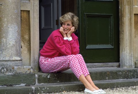 HIGHGROVE, UNITED KINGDOM - JULY 18:  Diana, Princess Of Wales, Sitting On The Steps Outside Her Country Home, Highgrove.  The Princess Is Casually Dressed In Pink Gingham Trousers With A Matching Pink Jumper.  (Photo by Tim Graham Photo Library via Getty Images)