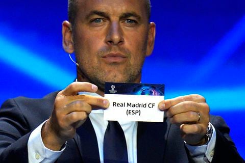 Former soccer star Joe Cole shows a ticket of soccer club Real Madrid during the 2023/24 UEFA Champions League group stage draw at the Grimaldi Forum in Monaco, Thursday, Aug. 31, 2013. (AP Photo/Daniel Cole)