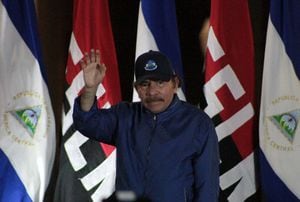 Nicaragua's President Daniel Ortega waves to the crowd during the inauguration of the Nejapa flyover in Managua on March 21, 2019. Nicaragua's government and opposition delegations resumed stalled peace talks Thursday aimed at ending a deadly 11-month political crisis. The resumption follows an agreement on Wednesday by the government of President Daniel Ortega to release all opposition prisoners within 90 days. (Photo by Maynor Valenzuela / AFP)