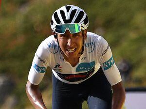 Team Ineos rider Colombia's Egan Bernal wearing the best young's white jersey arrives at the finish line of the 13th stage of the 107th edition of the Tour de France cycling race, 191 km between Chatel-Guyon and Puy Mary, on September 11, 2020. (Photo by Anne-Christine POUJOULAT / various sources / AFP)