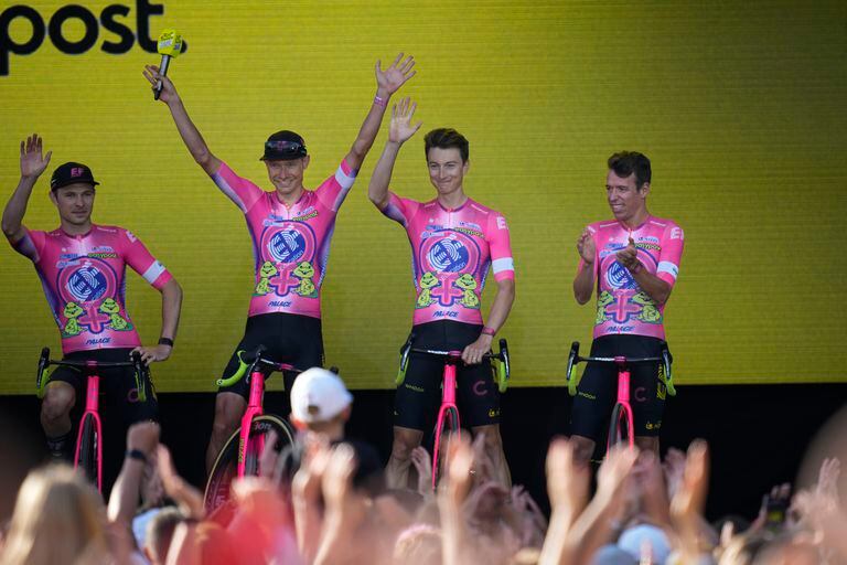 Magnus Cort Nielsen of Denmark, second left, Neilson Powless of the U.S., second right, and Rigoberto Uran of Colombia, right, of the EF Education EasyPost team greet fans during the team presentation ahead of the Tour de France cycling race in Copenhagen, Denmark, Wednesday, June 29, 2022. The race starts Friday, July 1, the first stage is an individual time trial over 13.2 kilometers (8.2 miles) with start and finish in Copenhagen. (AP Photo/Daniel Cole)