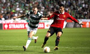Manchester United's Cristiano Ronaldo, right, and Omonia's Paris Psaltis fight for the ball during the Europa League group E soccer match between Omonia and Manchester United at GSP stadium in Nicosia, Cyprus, Thursday, Oct. 6, 2022. (AP Photo/Maria Karadjias)