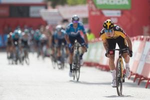 The overall leader Team Jumbo's Slovenian rider Primoz Roglic crosses the finish line as he wins the 11th stage of the 2021 La Vuelta cycling tour of Spain, a 133.6 km race from Antequera to Valdepenas de Jaen, on August 25, 2021. (Photo by JORGE GUERRERO / AFP)