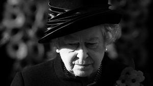 FILE PHOTO: Britain's Queen Elizabeth stands during the Remembrance Sunday service at the Cenotaph in Whitehall, London, Britain, November 12, 2006.   REUTERS/Stephen Hird/File Photo