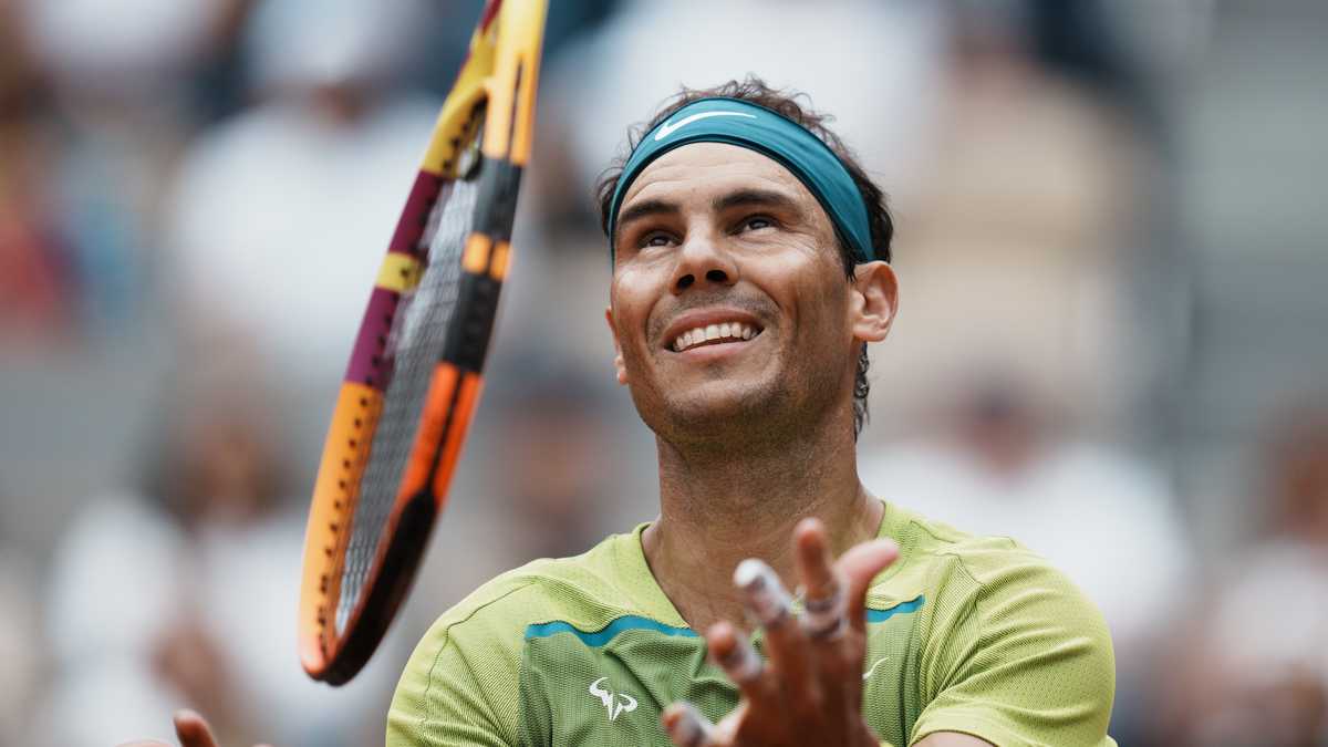 Spain's Rafael Nadal juggles with his racket during his first round match against Australia's Jordan Thompson at the French Open tennis tournament in Roland Garros stadium in Paris, France, Monday, May 23, 2022. (AP Photo/Thibault Camus)