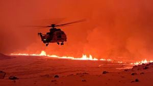 This handout image shows an Icelandic Coast Guard helicopter overflying an volcanic eruption on the Reykjanes peninsula 3 km north of Grindavik, western Iceland on December 19, 2023. A volcanic eruption began on Monday night in Iceland, south of the capital Reykjavik, following an earthquake swarm, Iceland's Meteorological Office reported. (Photo by Icelandic Coast Guard / HANDOUT / AFP) / RESTRICTED TO EDITORIAL USE - MANDATORY CREDIT "AFP PHOTO /   " - NO MARKETING NO ADVERTISING CAMPAIGNS - DISTRIBUTED AS A SERVICE TO CLIENTS
