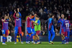 FC Barcelona's players celebrates at the end of the Spanish league football match between FC Barcelona and RCD Espanyol, at the Camp Nou stadium in Barcelona on November 20, 2021. (Photo by Pau BARRENA / AFP)