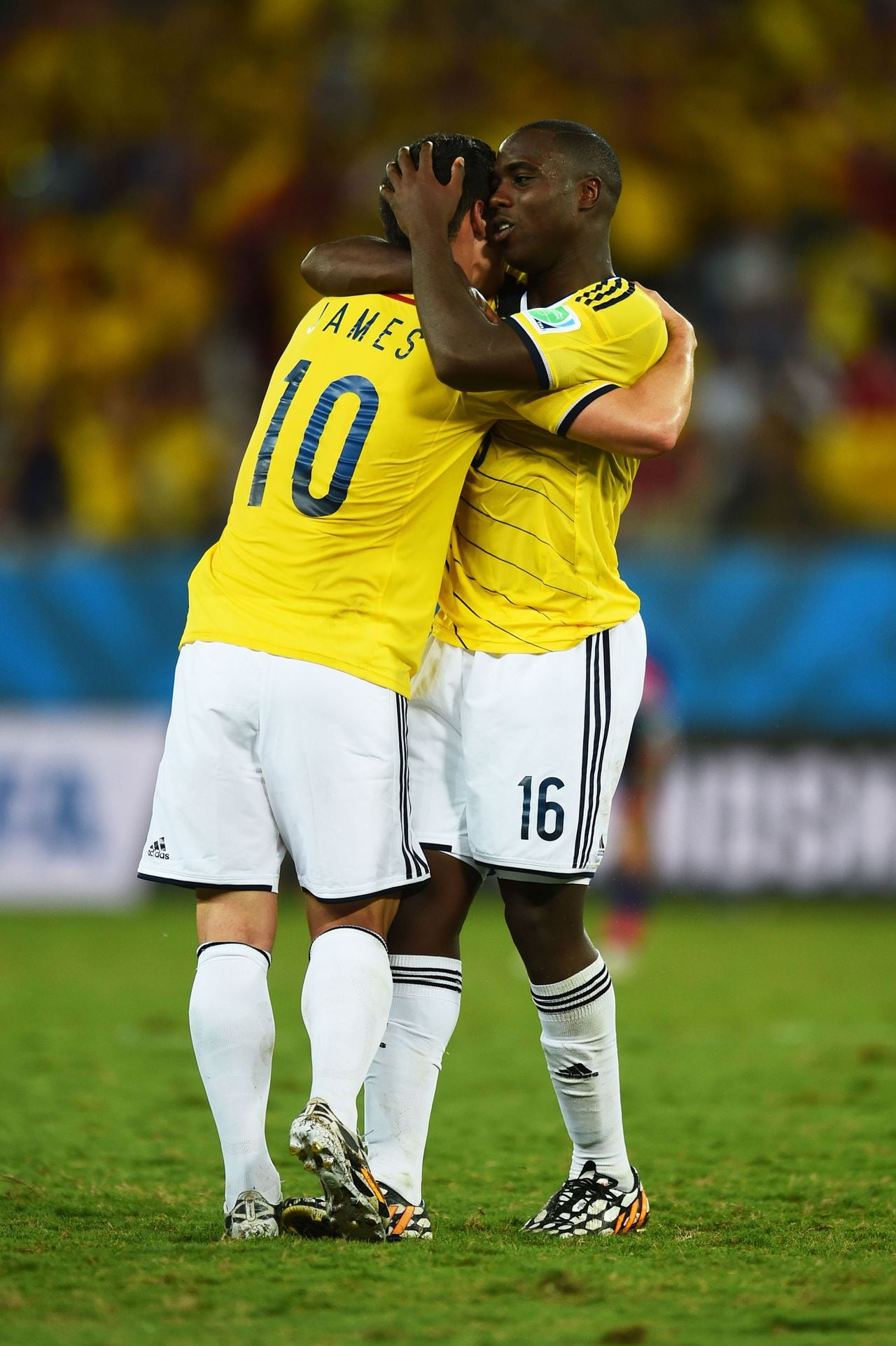 CUIABA, BRAZIL - JUNE 24:  James Rodriguez of Colombia (L) celebrates with Eder Alvarez Balanta of Colombia after the 2014 FIFA World Cup Brazil Group C match between Japan and Colombia at Arena Pantanal on June 24, 2014 in Cuiaba, Brazil.  (Photo by Dennis Grombkowski - FIFA/FIFA via Getty Images)