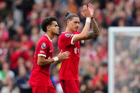 Liverpool's Luis Diaz, left, and Liverpool's Darwin Nunez coming off to get substituted during the English Premier League soccer match between Liverpool and West Ham at the Anfield stadium in Liverpool, England, Sunday, Sept. 24, 2023. (AP Photo/Jon Super)