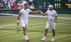 LONDON, ENGLAND - July 13: Robert Farah of Colombia and Juan Sebastian Cabal of Colombia in action against Nicolas Mahut of France and Edouard Roger-Vasselin of France in the Men's Doubles Final on Centre Court during the Wimbledon Lawn Tennis Championships at the All England Lawn Tennis and Croquet Club at Wimbledon on July 13, 2019 in London, England. (Photo by Tim Clayton/Corbis via Getty Images)