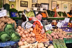 STOCKPORT-ENGLAND- MARCH 12: A man prepares his green grocer market stall at Stockport Market on March 12, 2021 in Stockport, England. (Photo by Nathan Stirk/Getty Images)