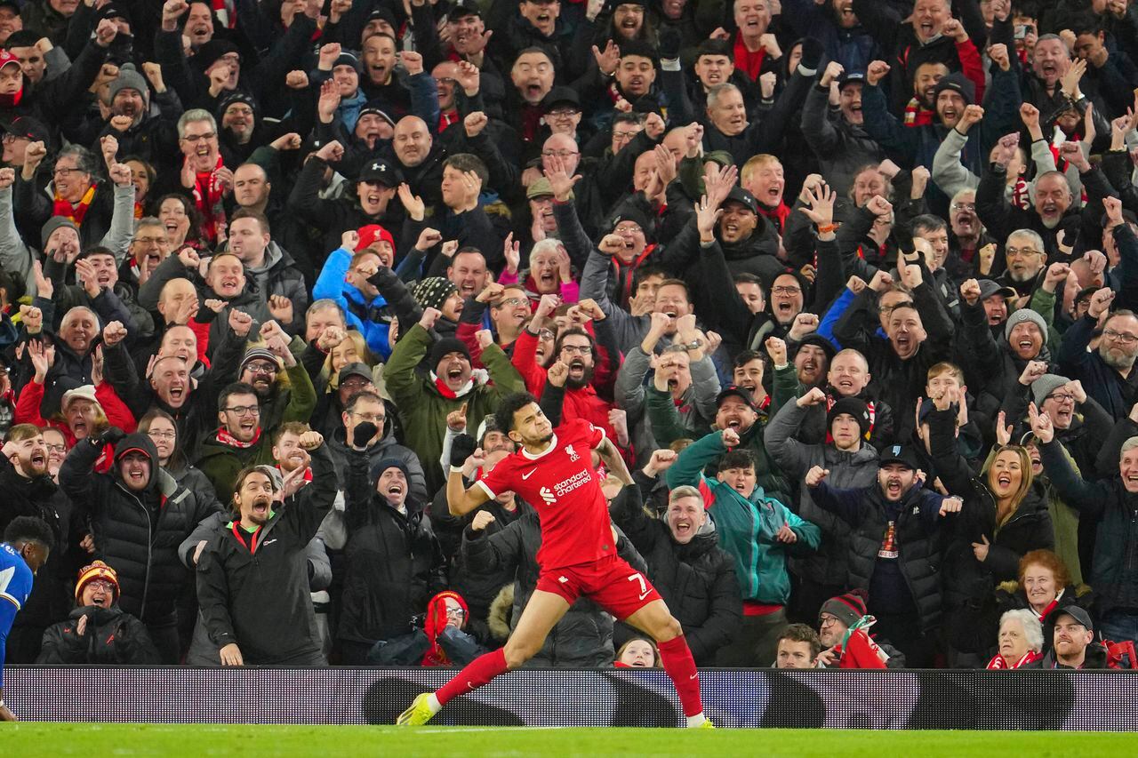 Liverpool's Luis Diaz celebrates after scoring his side's fourth goal during the English Premier League soccer match between Liverpool and Chelsea, at Anfield Stadium, Liverpool, England, Wednesday, Jan.31, 2024. (AP Photo/Jon Super)