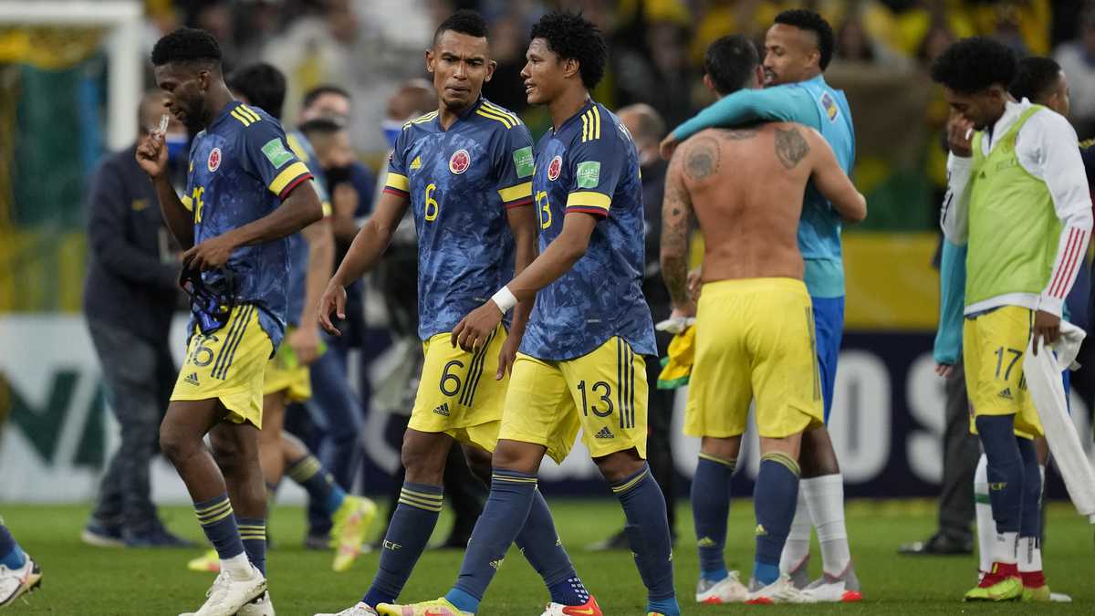 Players of Colombia leave the field after losing 1-0 against Brazil at the end of a qualifying soccer match for the FIFA World Cup Qatar 2022 at Neo Quimica Arena stadium in Sao Paulo, Brazil, Thursday, Nov.11, 2021. (AP Photo/Andre Penner)