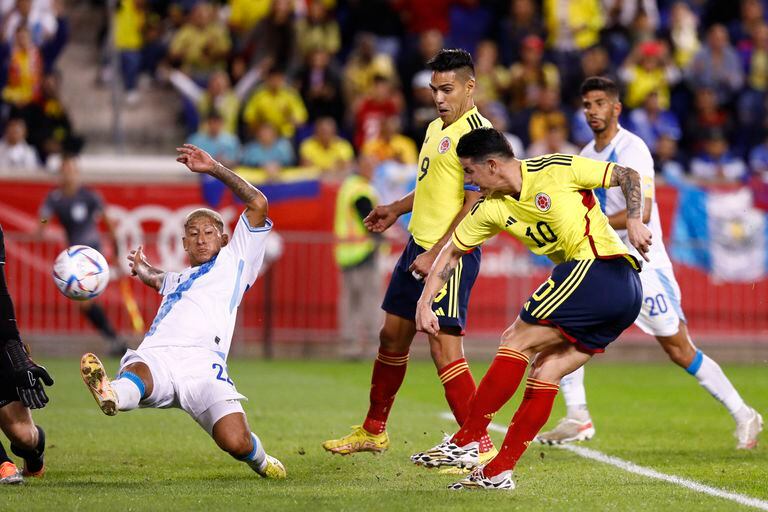 Colombia�s James Rodriguez (R) scores his goal during the international friendly football match between Colombia and Guatemala at Red Bull Arena in Harrison, New Jersey, on September 24, 2022. (Photo by Andres Kudacki / AFP)