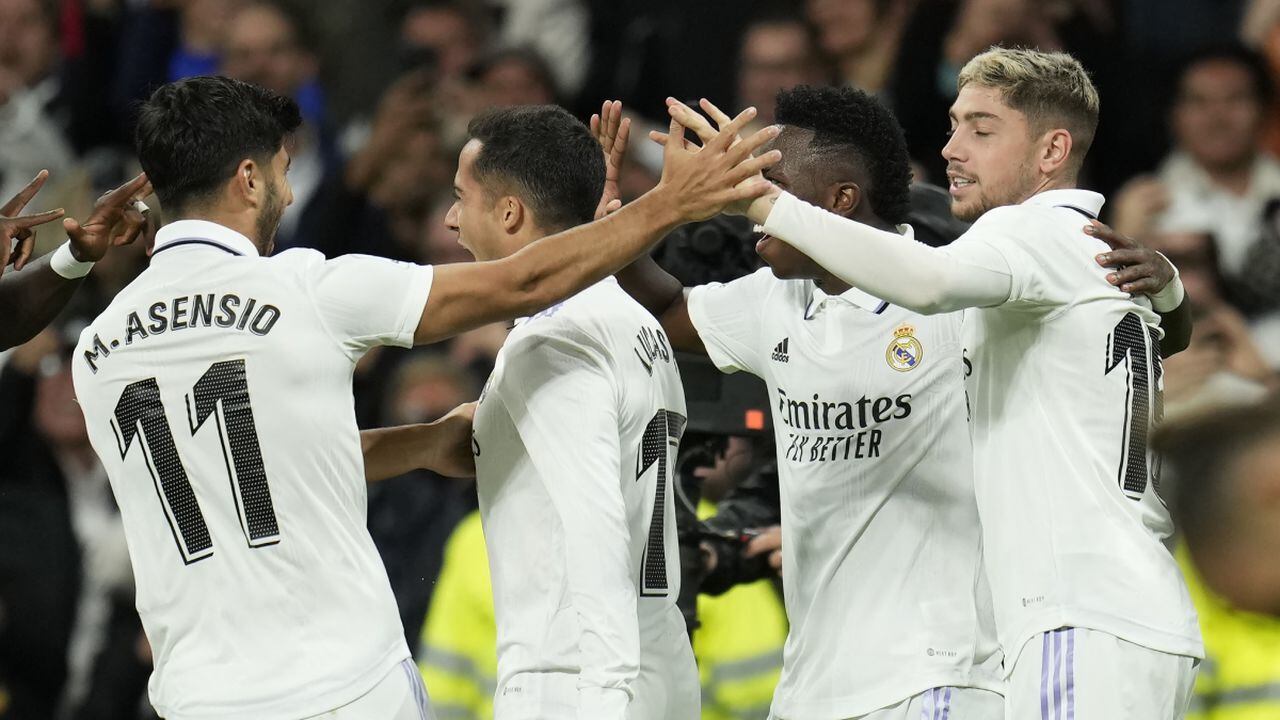 Real Madrid's Lucas Vazquez, second from left, celebrates with teammates after scoring his side's second goal during the Spanish La Liga soccer match between Real Madrid and Sevilla at the Santiago Bernabeu stadium in Madrid, Saturday, Oct. 22, 2022. (AP/Manu Fernandez)