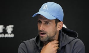 Serbia's Novak Djokovic reacts during a press conference ahead of the Australian Open tennis championship in Melbourne, Australia, Saturday, Jan. 14, 2023. (AP Photo/Aaron Favila)