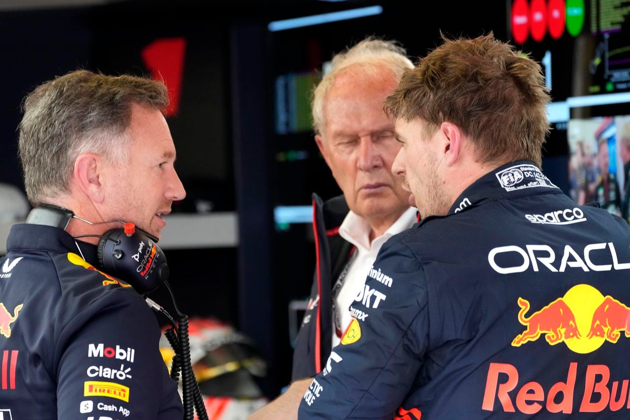 Red Bull driver Max Verstappen of the Netherlands, right, talks to his team's chief Christian Horner, left, in the pit lane during a practice session at the Baku circuit in Baku, Azerbaijan, Friday, April 28, 2023. The Formula One Grand Prix will be held on Sunday April 30, 2023. (AP Photo/Darko Bandic)