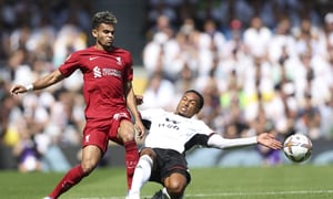 Liverpool's Luis Diaz, left, and Fulham's Kenny Tete vie for the ball during the English Premier League soccer match between Fulham and Liverpool at Craven Cottage stadium in London, Saturday, Aug. 6, 2022. (AP Photo/Ian Walton)