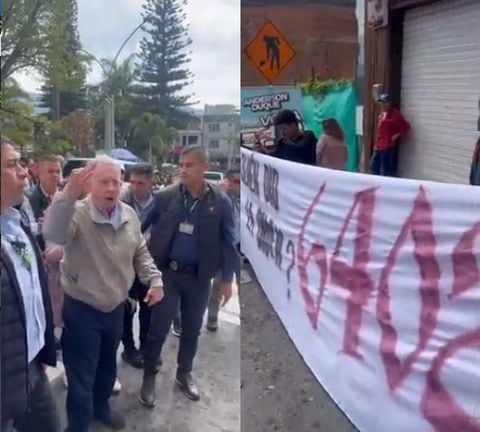 Durante su visita, Uribe se encontró con un grupo de jóvenes que llevaban una pancarta con la inscripción “¿Quién dio la orden 6.402?”
