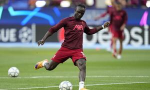 Liverpool's Sadio Mane takes a shot during warmup before the Champions League final soccer match between Liverpool and Real Madrid at the Stade de France in Saint Denis near Paris, Saturday, May 28, 2022. (AP/Manu Fernandez)