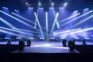 Online concert. Event entertainment concept. Background for online concert. Blue stage spotlights. Empty stage with blue spotlights. Blue stage lights. Online COVID-19 concert. Live streaming concert