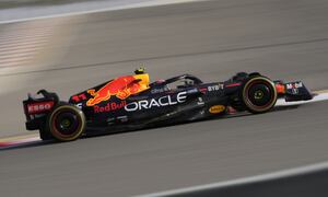 Red Bull driver Sergio Perez of Mexico steers his car during a practice for theFormula One Bahrain Grand Prix it in Sakhir, Bahrain, Friday, March 18, 2022. (AP Photo/Hassan Ammar)